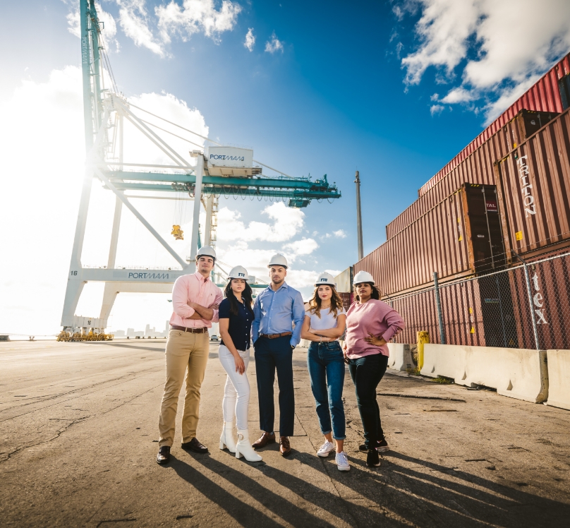 Well-composed photo of FIU students and alumni at the Port of Miami