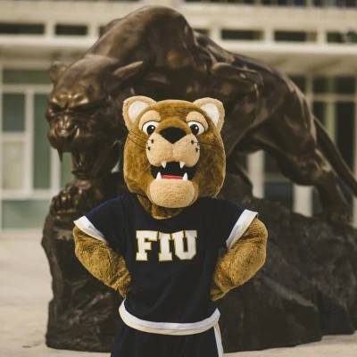 Roary posing in front of the FIU Panther statue