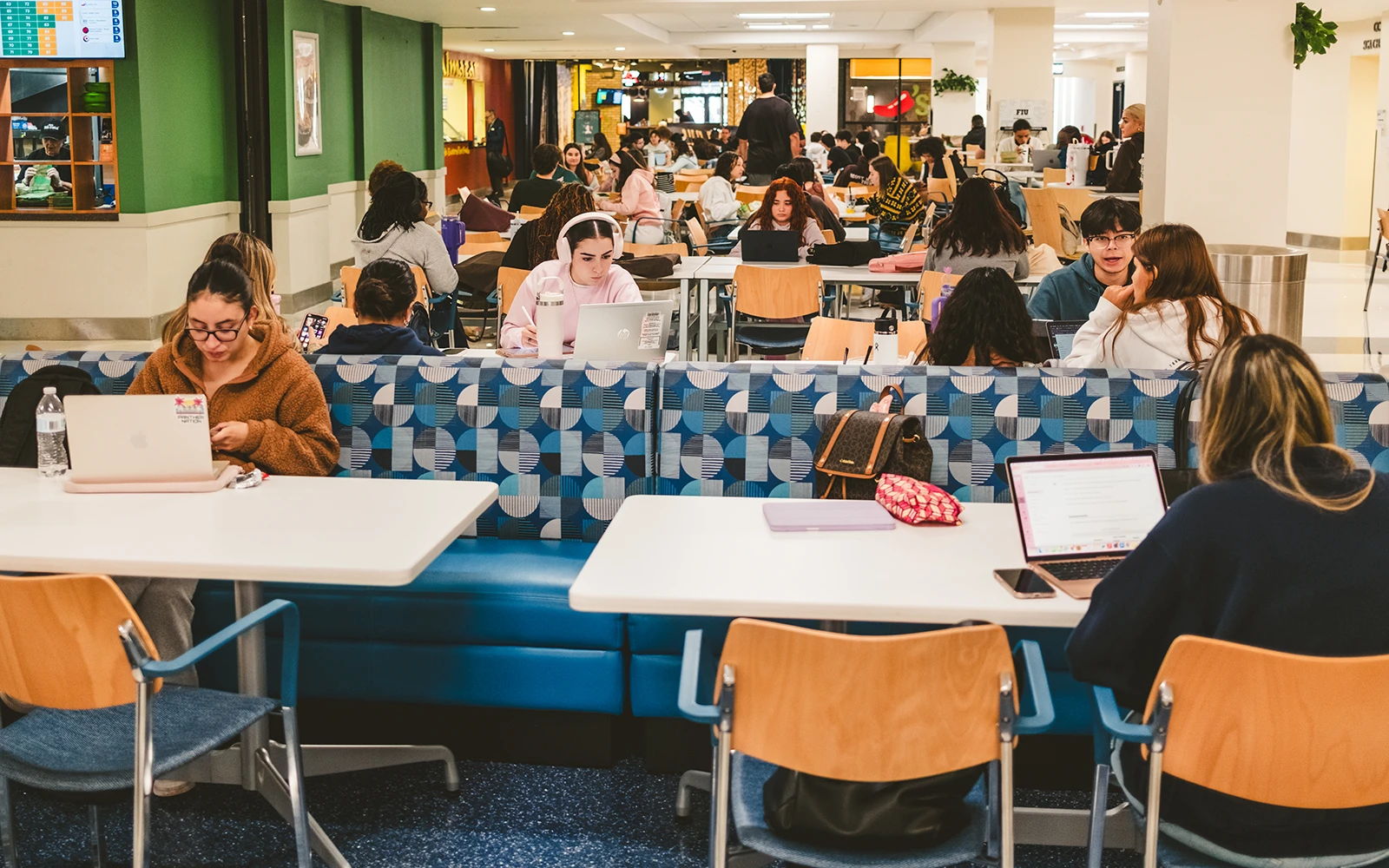 FIU cafeteria with students mingling and eating