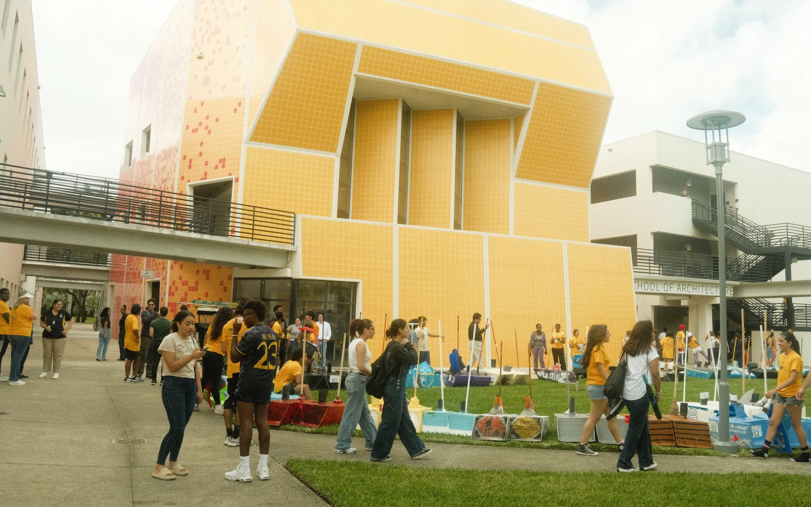 FIU students preparing for Walk on Water 2024 in front of the architecture building